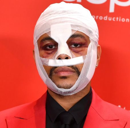 The Weeknd was seen with bandages on his face at American Music Awards.